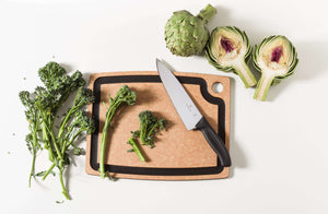 Epicurean Gourmet Series Cutting Board in Natural slicing up brocolinis and artichokes with a Victorinox Swiss Classic Chef's Knife 