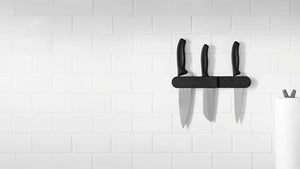 The Epicurean Wall Mounted Knife Holder featuring three Victorinox Knives being held with gravity only. 